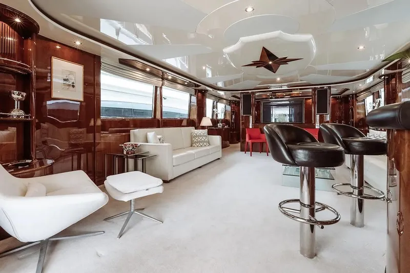 Let It Be Yacht Photos Pics Luxurious interior of 1998 Tecnomarine 118 yacht with elegant seating and modern decor.