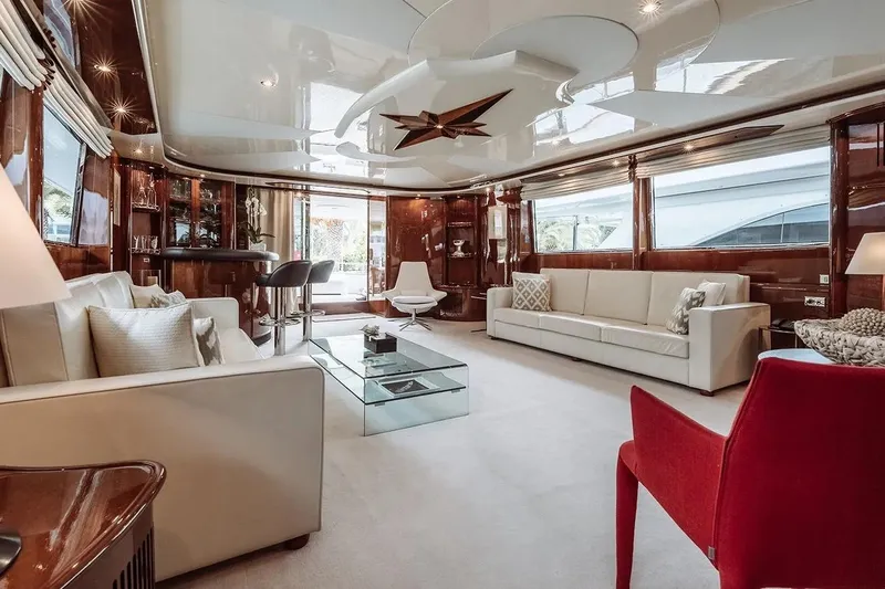 Let It Be Yacht Photos Pics Luxurious interior of 1998 Tecnomarine 118 yacht with elegant seating and modern decor.