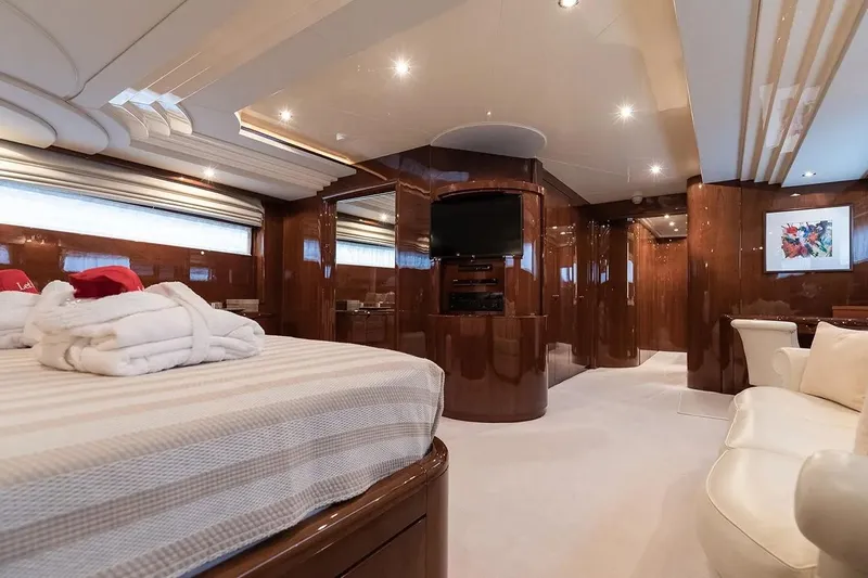 Let It Be Yacht Photos Pics Luxurious interior of 1998 Tecnomarine 118 yacht with elegant wood finishes and modern amenities.
