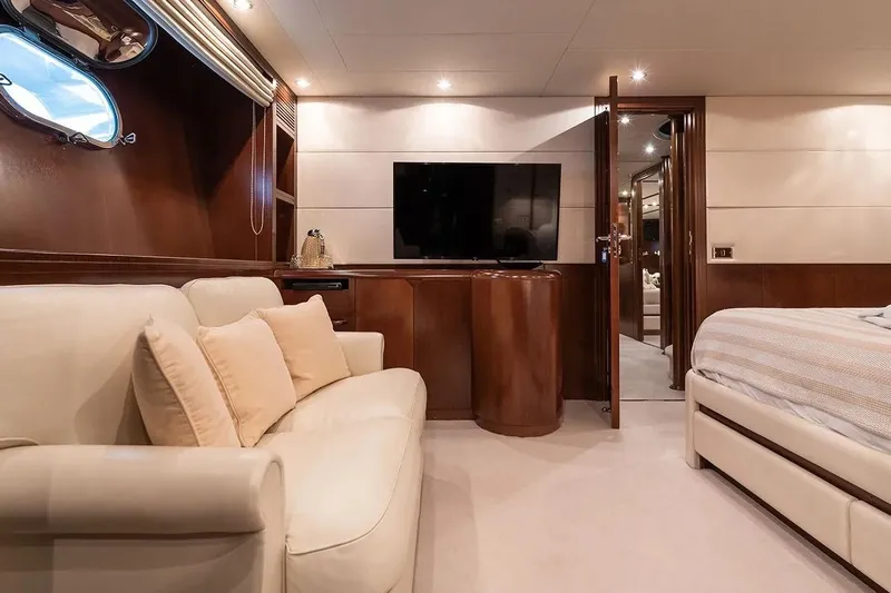 Let It Be Yacht Photos Pics Luxurious Tecnomarine 118 yacht interior, featuring elegant wood paneling, plush seating, and modern amenities.