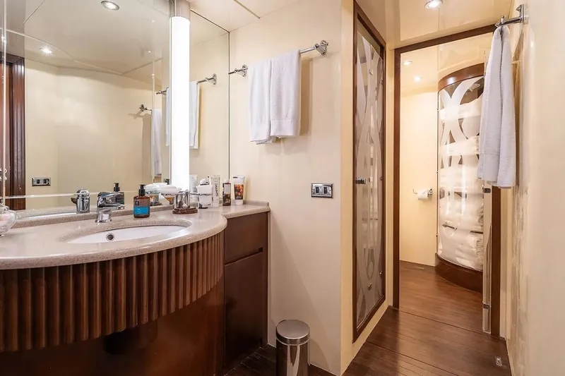 Let It Be Yacht Photos Pics Luxurious bathroom interior on 1998 Tecnomarine 118 yacht, featuring elegant fixtures and modern design.