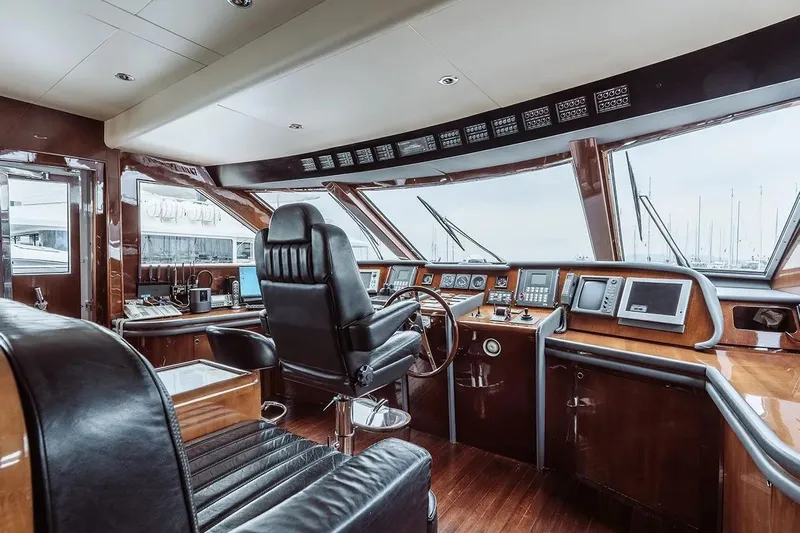 Let It Be Yacht Photos Pics Luxurious 1998 Tecnomarine 118 yacht cockpit with leather seating and advanced navigation equipment.