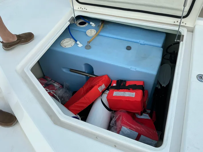 The Dance Yacht Photos Pics Storage compartment of 2019 Leopard 51 Powercat with life jackets and equipment.
