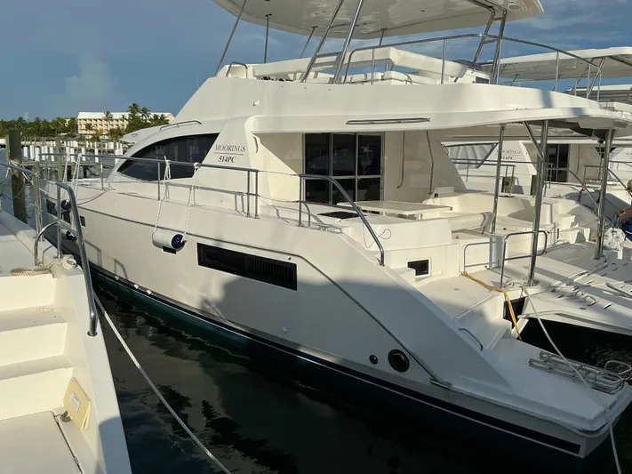 The Dance Yacht Photos Pics 2019 Leopard 51 Powercat yacht docked at marina, side view.