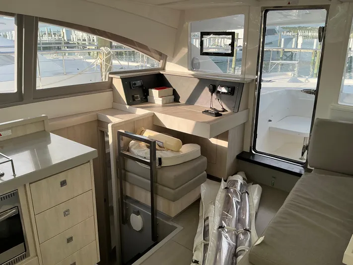 The Dance Yacht Photos Pics Interior of 2019 Leopard 51 Powercat yacht with modern seating and navigation area.