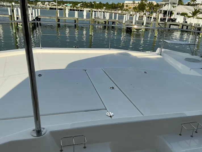 The Dance Yacht Photos Pics 2019 Leopard 51 Powercat deck overlooking marina with docked boats.
