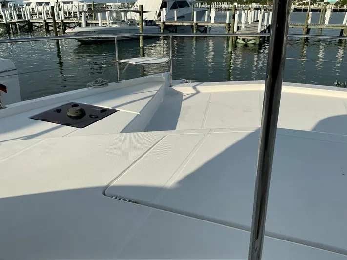 The Dance Yacht Photos Pics 2019 Leopard 51 Powercat deck view at marina with boats and docks in background.