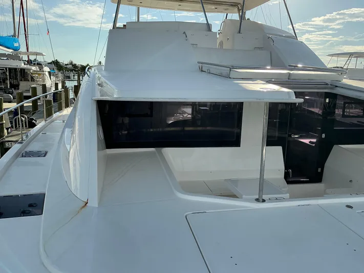 The Dance Yacht Photos Pics 2019 Leopard 51 Powercat yacht docked, showcasing sleek design and spacious deck.