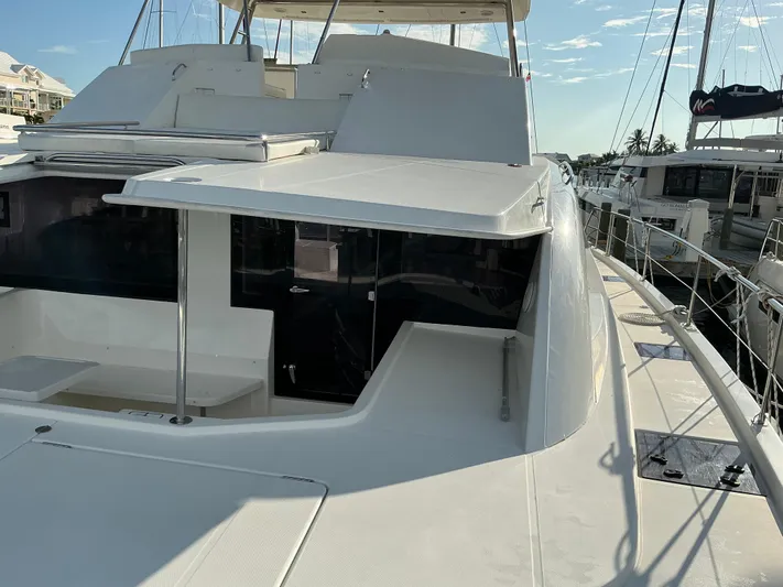 The Dance Yacht Photos Pics 2019 Leopard 51 Powercat yacht docked, showcasing sleek design and spacious deck area.