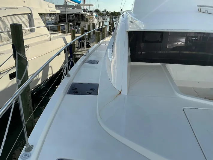 The Dance Yacht Photos Pics 2019 Leopard 51 Powercat yacht docked at marina, showcasing sleek deck design.