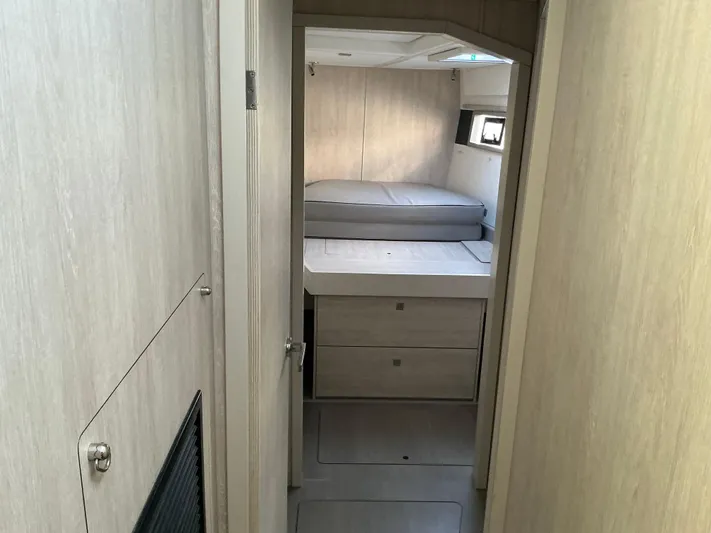 The Dance Yacht Photos Pics 2019 Leopard 51 Powercat cabin interior with bed and storage drawers.