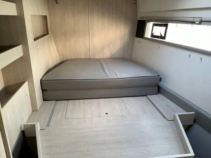 The Dance Yacht Photos Pics 2019 Leopard 51 Powercat interior cabin with bed, modern design, and light wood finish.