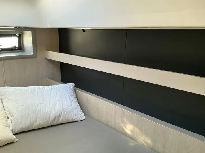 The Dance Yacht Photos Pics Interior cabin of 2019 Leopard 51 Powercat with bed and window.