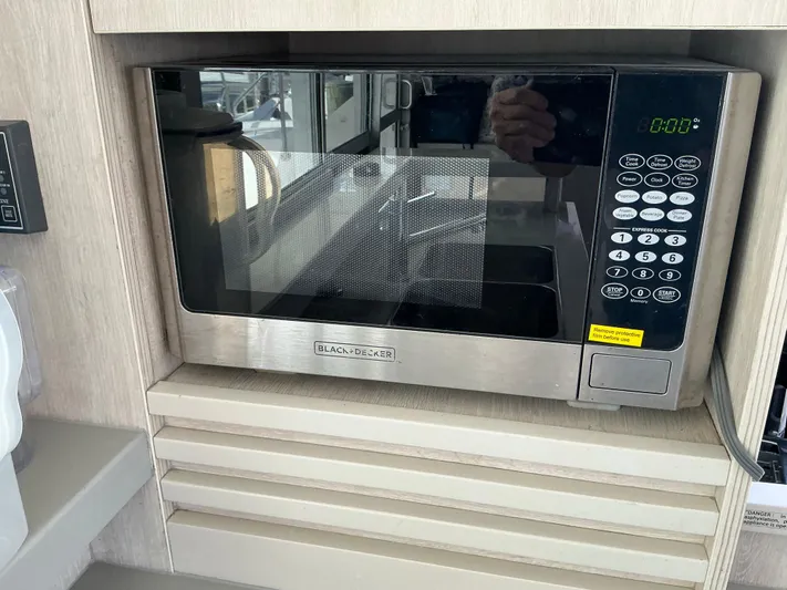 The Dance Yacht Photos Pics Microwave in 2019 Leopard 51 Powercat kitchen, featuring digital controls and sleek design.