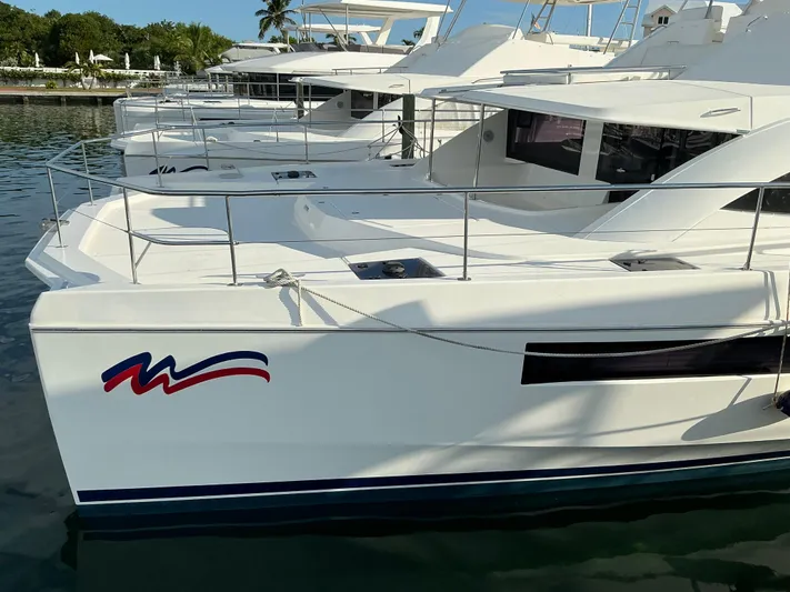The Dance Yacht Photos Pics 2019 Leopard 51 Powercat docked, showcasing sleek design and spacious deck.