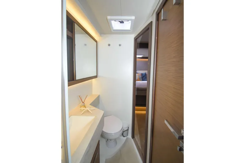 Yacht Photos Pics Modern bathroom interior on 2021 Lagoon 50 yacht, featuring sleek design and natural lighting.