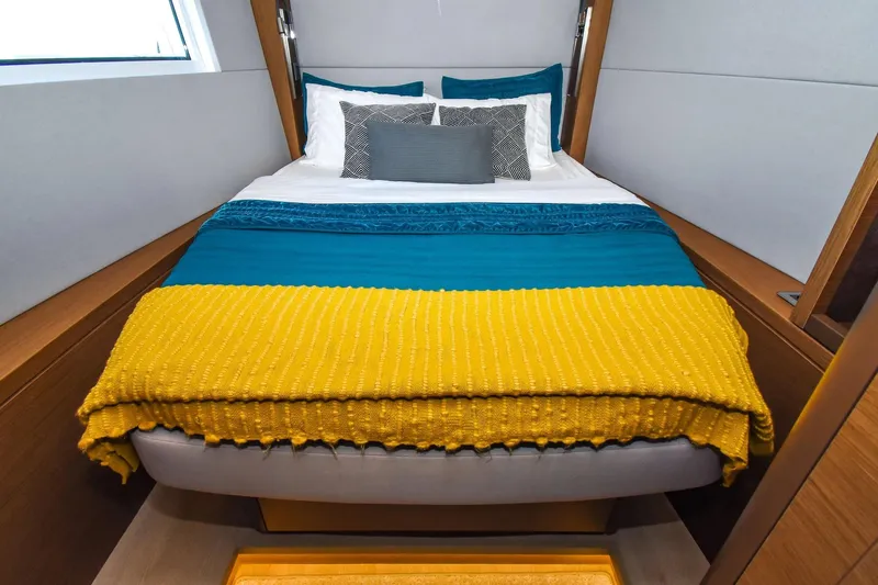  Yacht Photos Pics Cozy bedroom in 2021 Lagoon 50 yacht with colorful bedding and modern design.