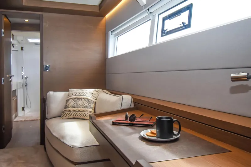  Yacht Photos Pics Luxurious interior of 2021 Lagoon 50 yacht with cozy seating and modern decor.