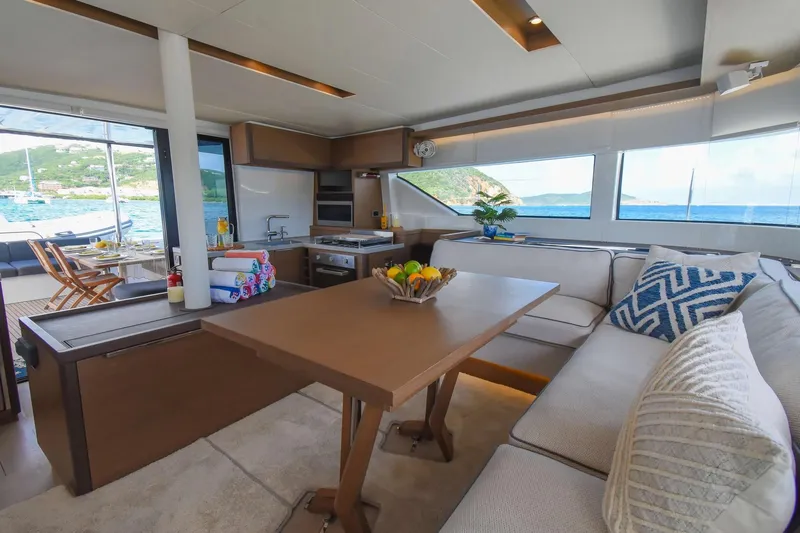  Yacht Photos Pics Luxurious interior of 2021 Lagoon 50 yacht with ocean view and modern furnishings.