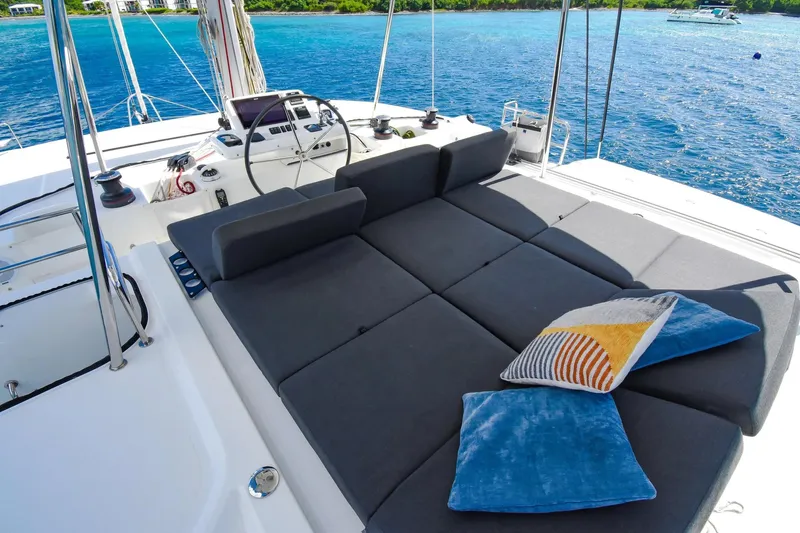  Yacht Photos Pics Luxurious 2021 Lagoon 50 catamaran deck with plush seating and scenic ocean view.