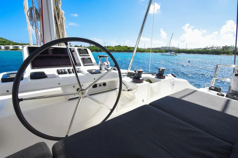  Yacht Photos Pics Cockpit view of 2021 Lagoon 50 catamaran with ocean backdrop and clear blue skies.