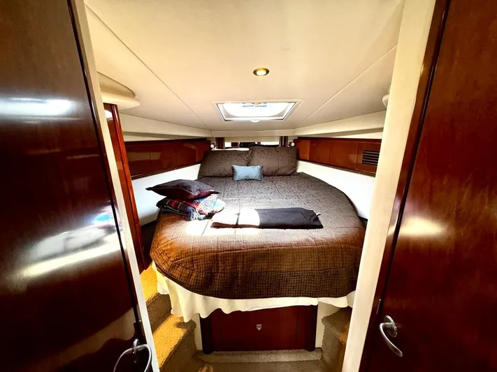  Yacht Photos Pics Luxurious cabin interior of 2010 Sea Ray 40 Sundancer yacht with cozy bed.