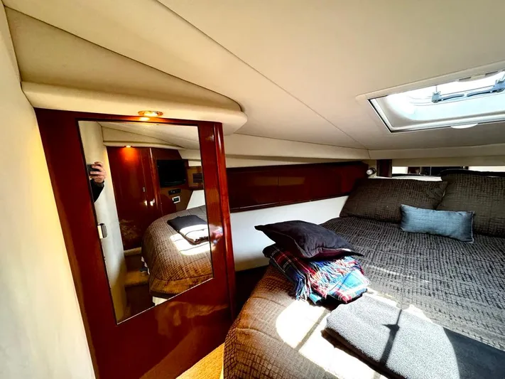  Yacht Photos Pics Luxurious cabin interior of 2010 Sea Ray 40 Sundancer yacht with cozy bedding.
