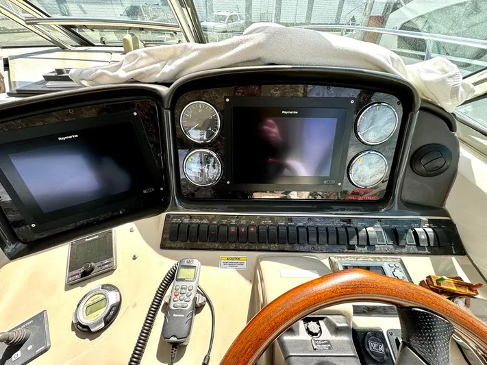  Yacht Photos Pics Dashboard of a 2010 Sea Ray 40 Sundancer yacht with navigation screens and controls.