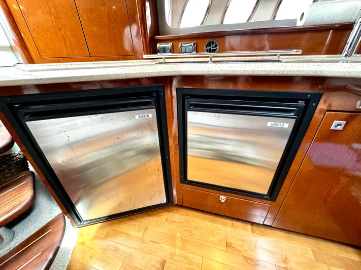  Yacht Photos Pics Luxurious 2010 Sea Ray 40 Sundancer yacht interior with stainless steel appliances and wooden cabinetry.