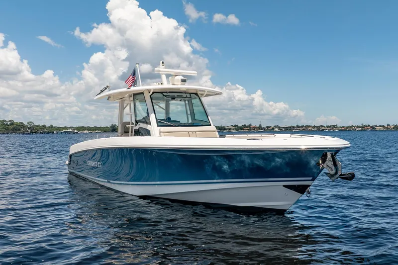 Crushed It Yacht Photos Pics 2018 Boston Whaler 380 Outrage boat on calm water under blue sky.
