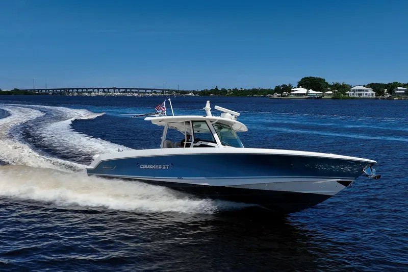 Crushed It Yacht Photos Pics 2018 Boston Whaler 380 Outrage cruising on a sunny day, leaving a wake behind.