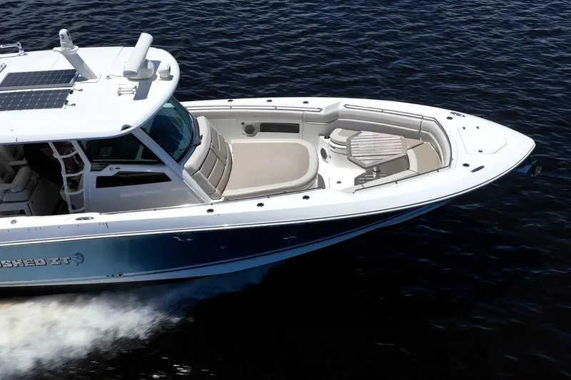 Crushed It Yacht Photos Pics 2018 Boston Whaler 380 Outrage cruising on water, showcasing sleek design and spacious deck.