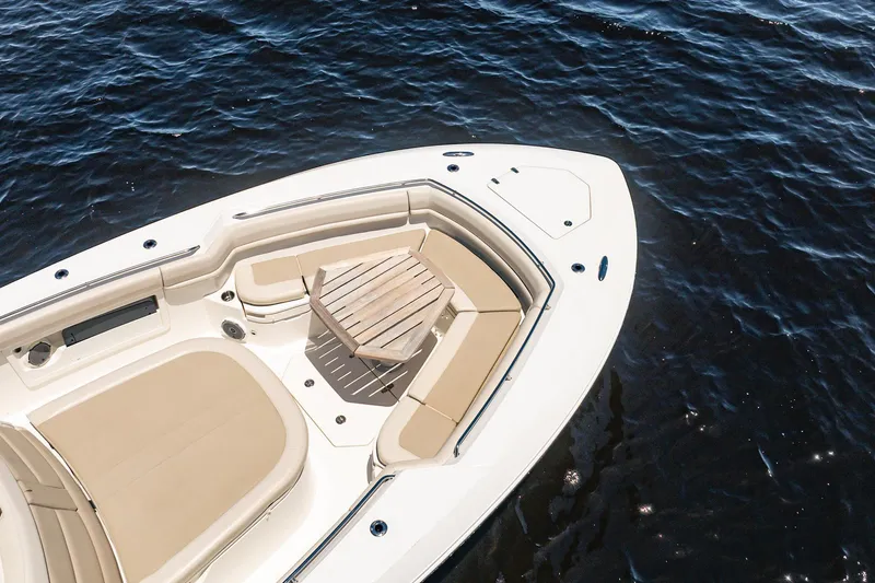 Crushed It Yacht Photos Pics 2018 Boston Whaler 380 Outrage boat with seating area on calm water.