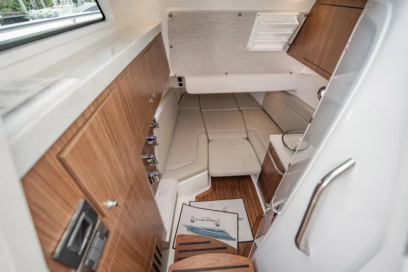 Crushed It Yacht Photos Pics 2018 Boston Whaler 380 Outrage cabin interior with wood accents and comfortable seating.