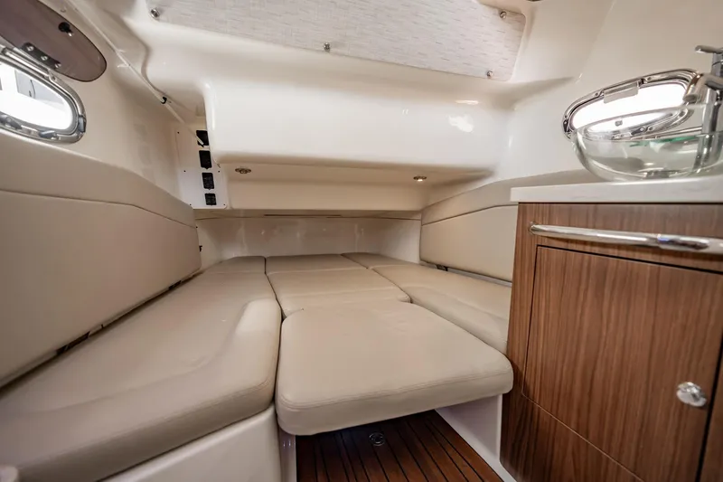 Crushed It Yacht Photos Pics Luxurious interior cabin of 2018 Boston Whaler 380 Outrage with plush seating and wood accents.