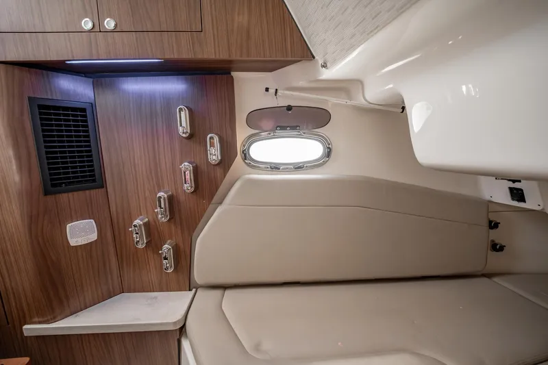 Crushed It Yacht Photos Pics 2018 Boston Whaler 380 Outrage cabin interior with wood paneling and seating.