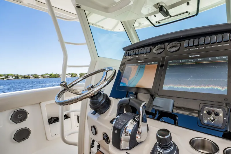 Crushed It Yacht Photos Pics 2018 Boston Whaler 380 Outrage helm with advanced navigation displays and controls.