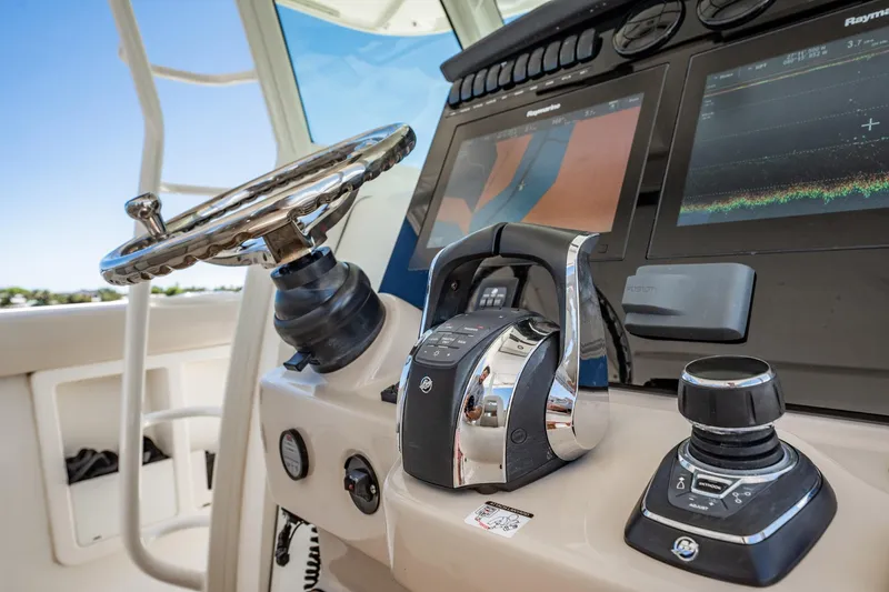 Crushed It Yacht Photos Pics Control panel of a 2018 Boston Whaler 380 Outrage boat with advanced navigation systems.