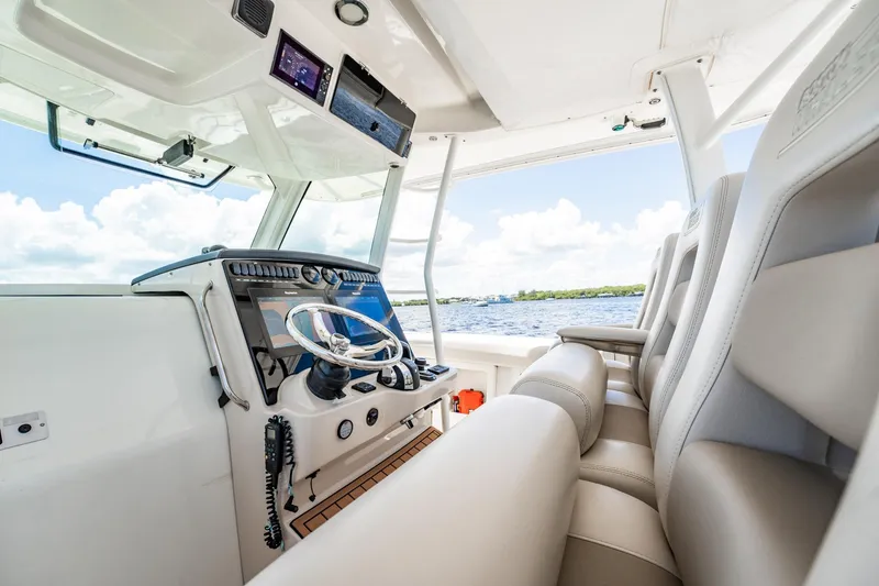 Crushed It Yacht Photos Pics 2018 Boston Whaler 380 Outrage helm with modern controls and luxurious seating.