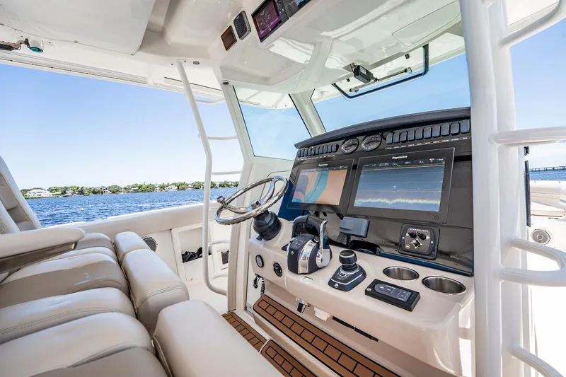 Crushed It Yacht Photos Pics 2018 Boston Whaler 380 Outrage helm with advanced navigation displays and luxurious seating.
