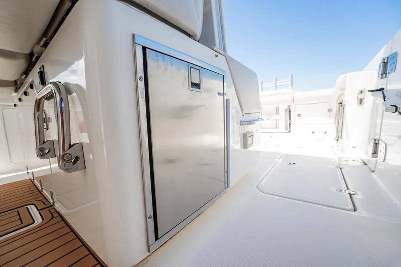 Crushed It Yacht Photos Pics 2018 Boston Whaler 380 Outrage boat interior with stainless steel features and teak flooring.