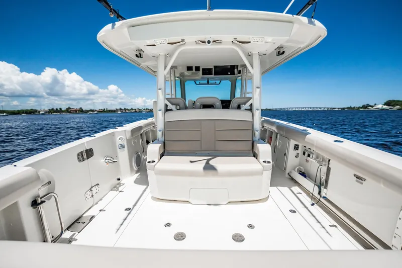 Crushed It Yacht Photos Pics 2018 Boston Whaler 380 Outrage boat interior with seating, on a sunny day at sea.