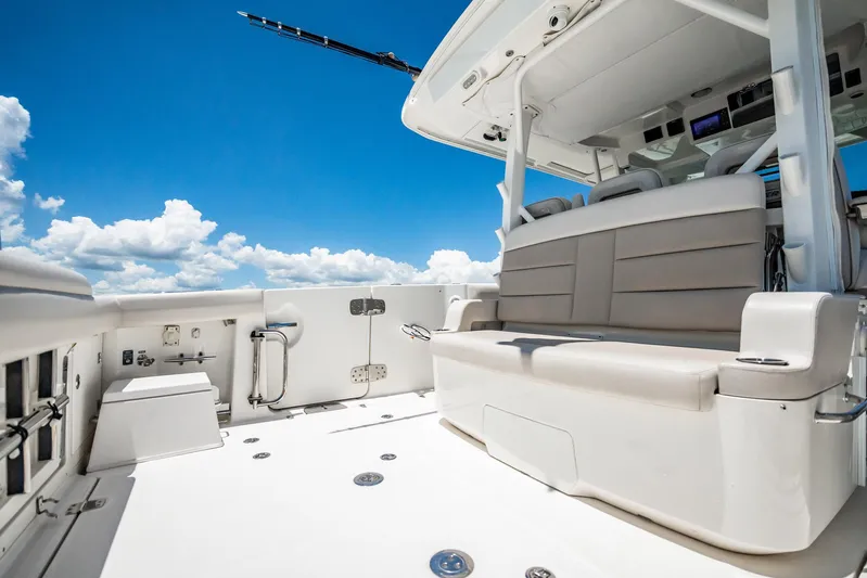 Crushed It Yacht Photos Pics 2018 Boston Whaler 380 Outrage boat interior with seating under clear blue sky.