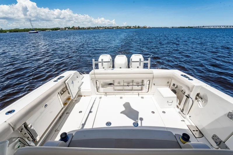 Crushed It Yacht Photos Pics 2018 Boston Whaler 380 Outrage boat deck with ocean view, clear sky, and calm waters.