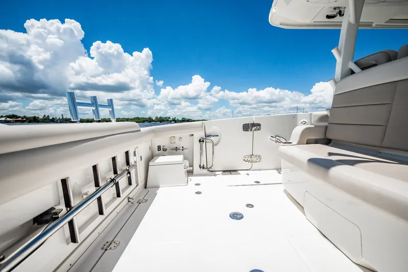 Crushed It Yacht Photos Pics 2018 Boston Whaler 380 Outrage deck, featuring seating and clear blue skies.