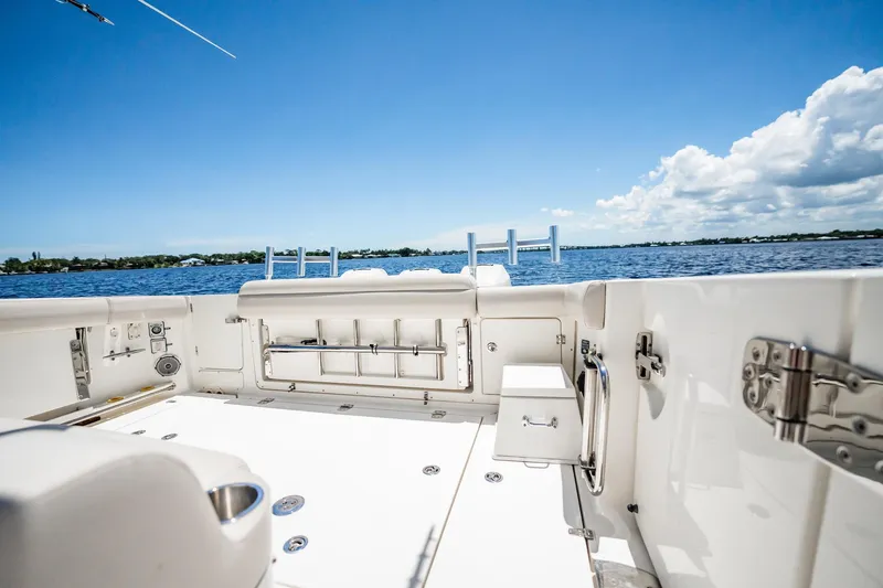 Crushed It Yacht Photos Pics 2018 Boston Whaler 380 Outrage boat deck with ocean view under clear blue sky.