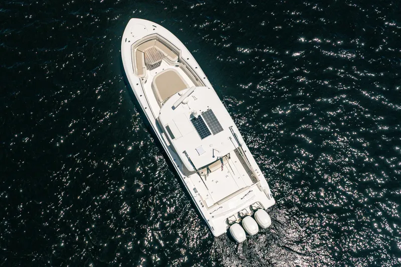 Crushed It Yacht Photos Pics Aerial view of 2018 Boston Whaler 380 Outrage boat on sparkling water.