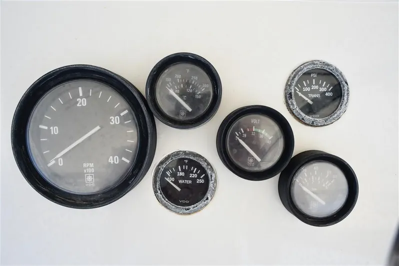  Yacht Photos Pics 1987 Hatteras Sportfish gauges, including RPM and pressure dials, on a white background.