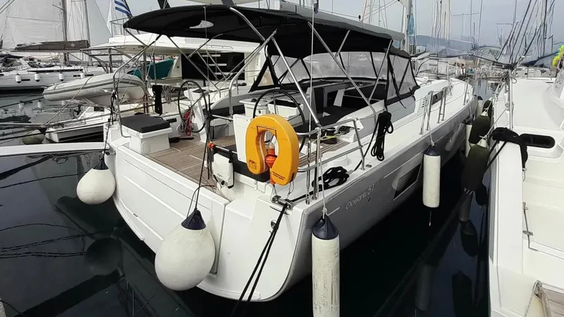 1725 Yacht Photos Pics Beneteau Oceanis 51.1 yacht, 2022 model, docked in a marina with fenders and lifebuoy.