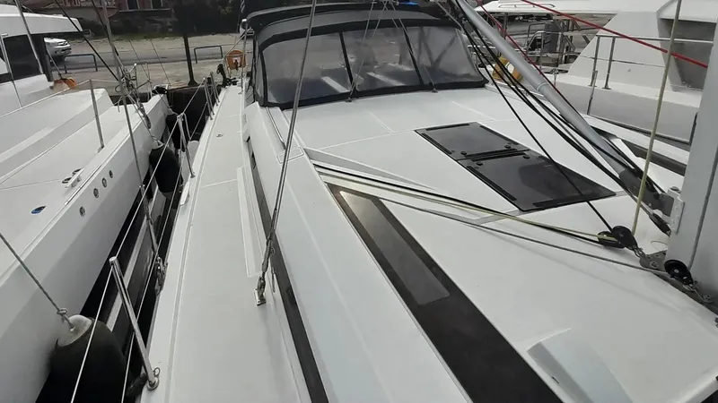 1725 Yacht Photos Pics Beneteau Oceanis 51.1 yacht, 2022 model, docked alongside other boats.